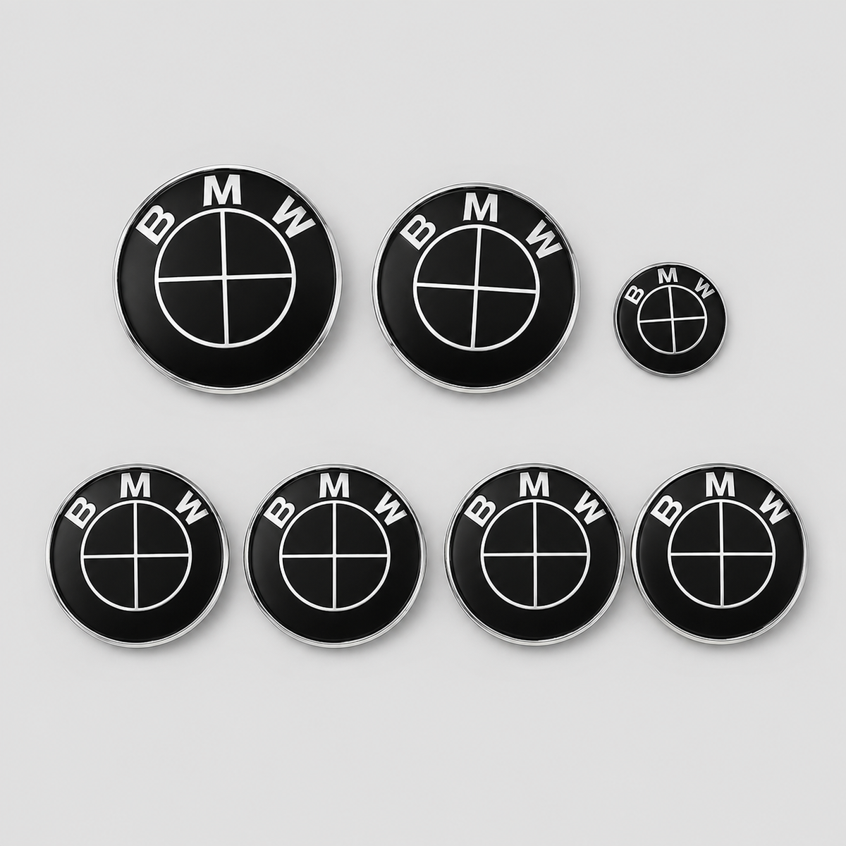 Seven-piece full black replacement emblem set compatible with BMW