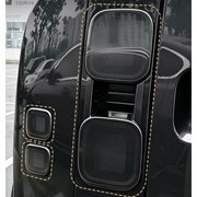 Close-up of smoked tail light and indicator covers fitted to Defender