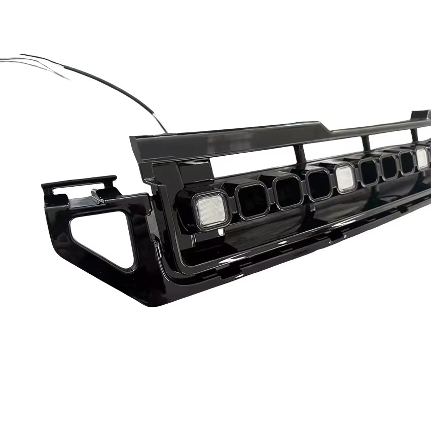 Left side detail of gloss black square LED front grille