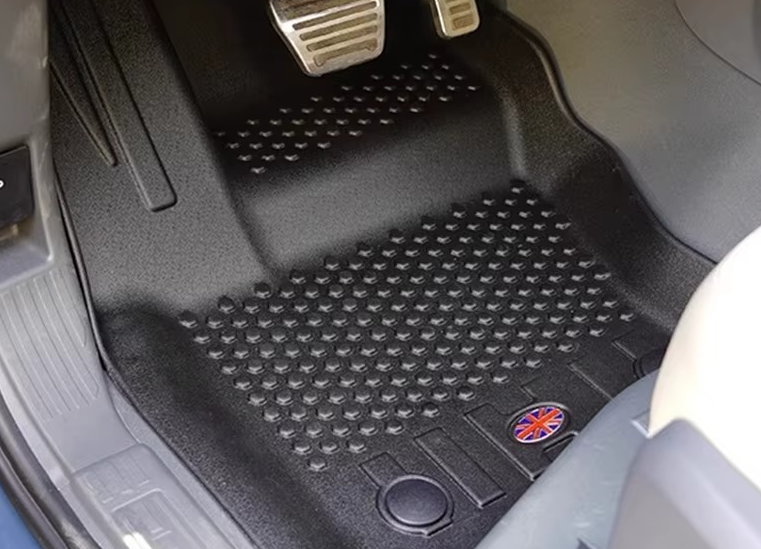 All-weather floor mat installed in Land Rover Defender 90 footwell