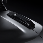 Gloss black bonnet vent trim fitted to a silver-grey Defender bonnet
