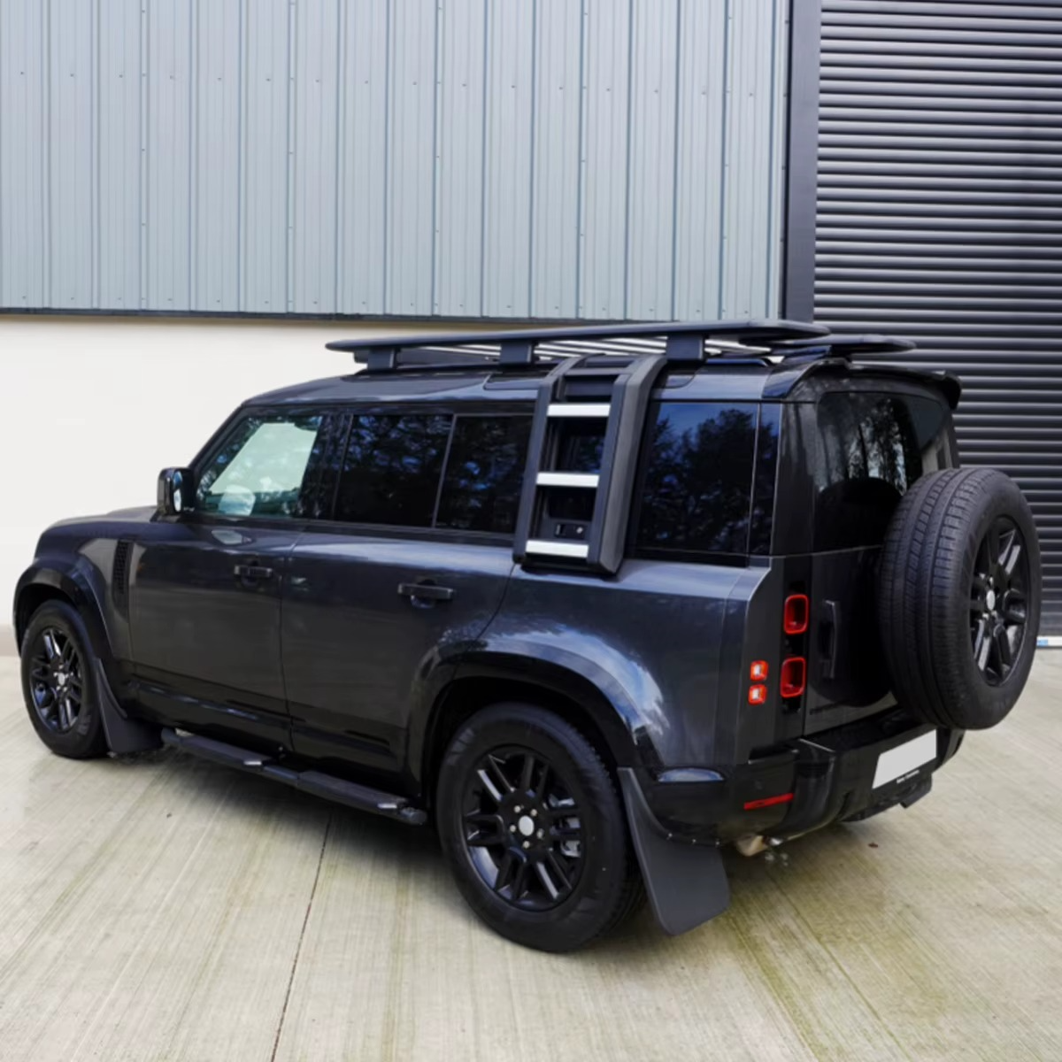 Land Rover Defender 110 fitted with black folding side ladder