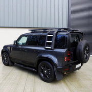 Land Rover Defender 110 fitted with black folding side ladder