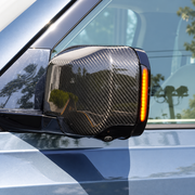 Amber LED mirror indicator illuminated on a Land Rover Defender side mirror