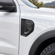 Matte-black side vent cover trim installed on a Ford Ranger