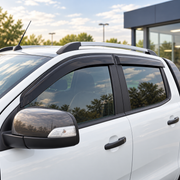 Dark smoke window deflectors installed on a white Ford Ranger Double Cab