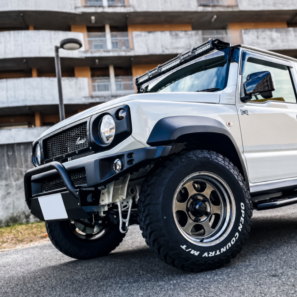 Suzuki Jimny JB64 JB74 fitted with narrow black front bumper and guard