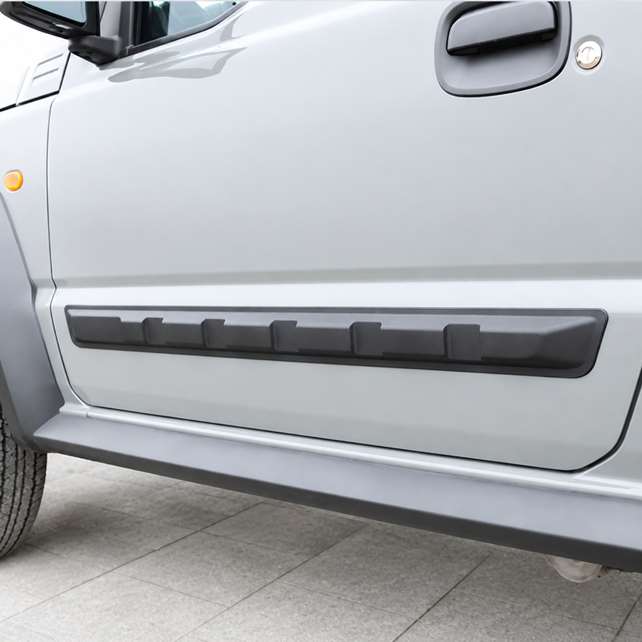 Black ABS side door protector fitted to Suzuki Jimny JB64 JB74 3 door
